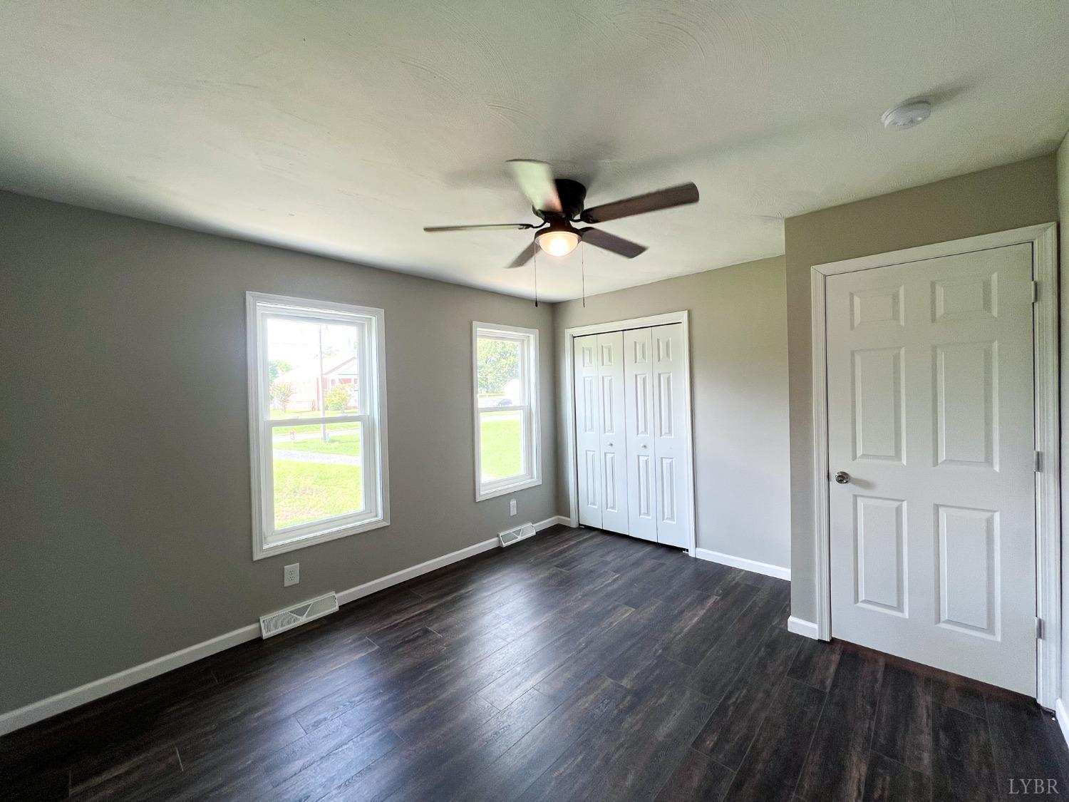 17 Phoebe Pond Road Concord, VA 24538 - Photo 14 of 19 a view of an empty room with wooden floor and a window