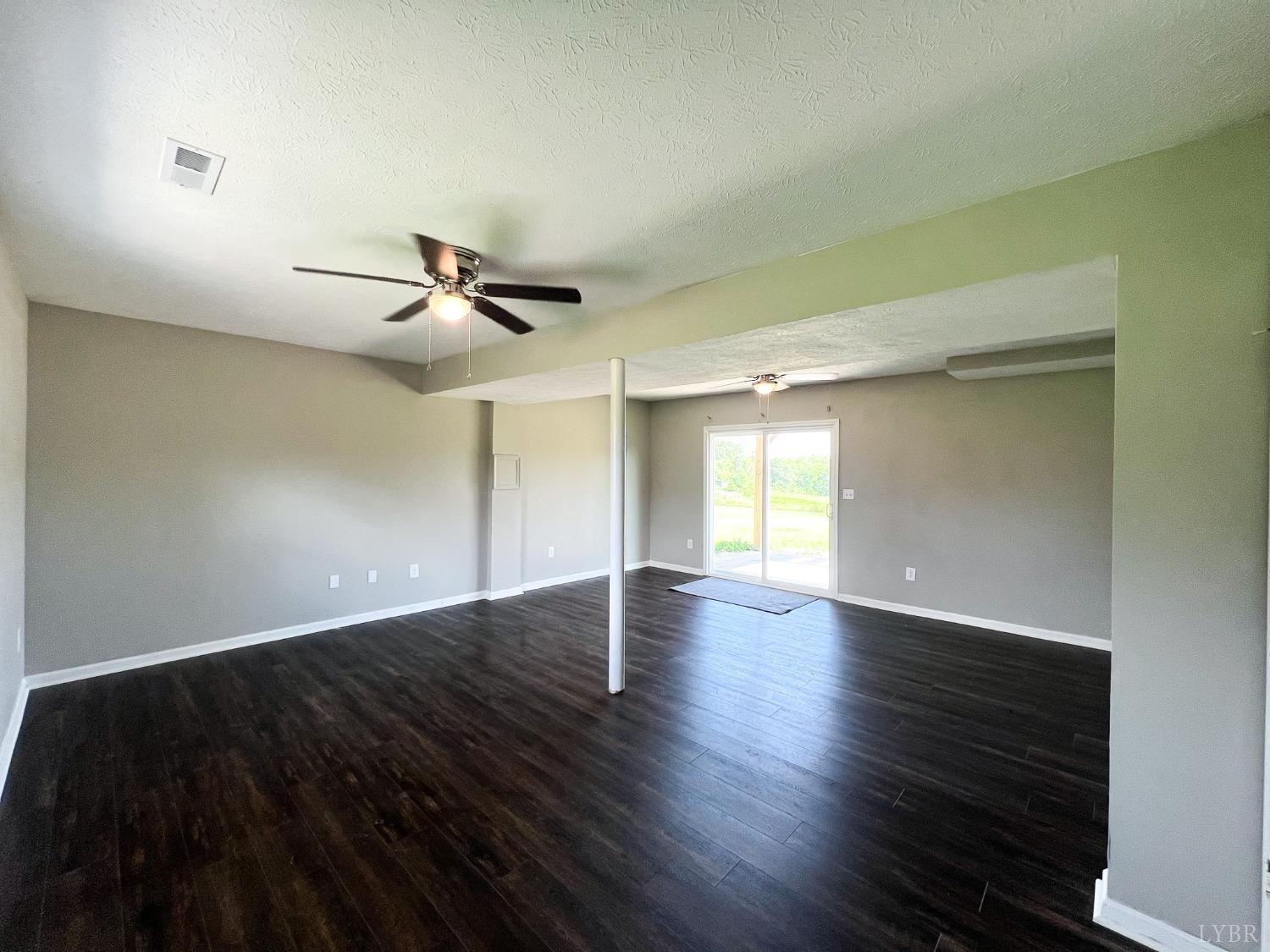 17 Phoebe Pond Road Concord, VA 24538 - Photo 15 of 19 a view of empty room with wooden floor and fan