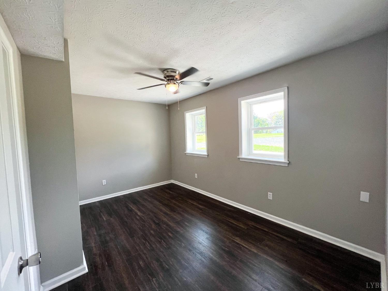 17 Phoebe Pond Road Concord, VA 24538 - Photo 17 of 19 an empty room with wooden floor and windows