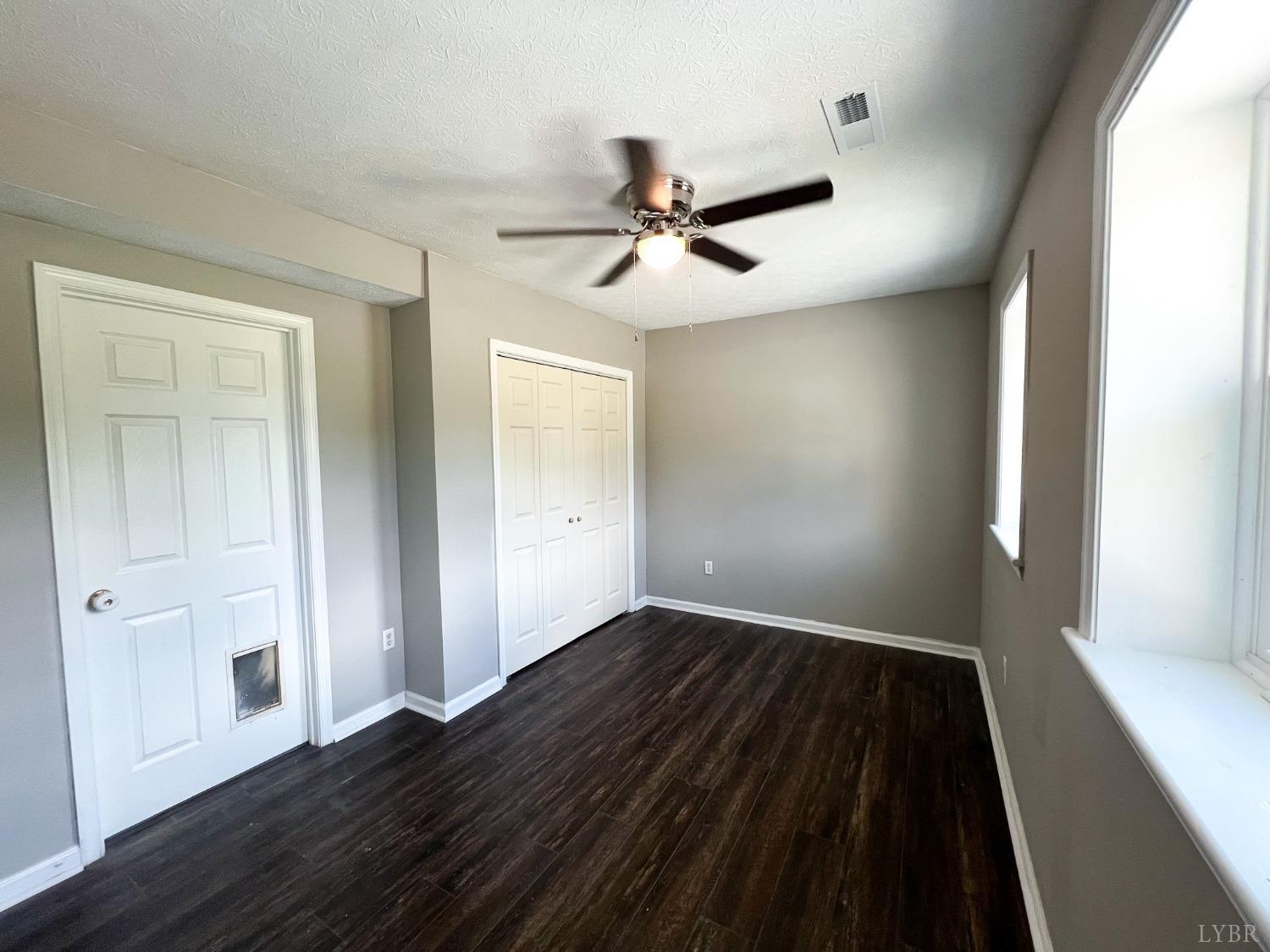 17 Phoebe Pond Road Concord, VA 24538 - Photo 18 of 19 an empty room with wooden floor closet and windows