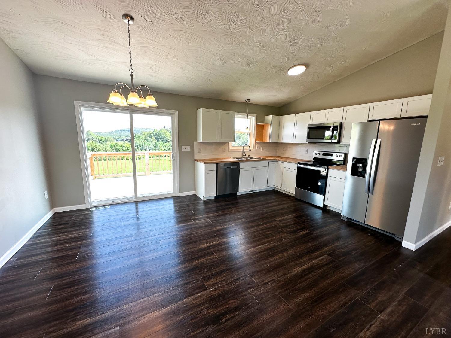 17 Phoebe Pond Road Concord, VA 24538 - Photo 3 of 19 a kitchen with stainless steel appliances granite countertop a refrigerator a stove top oven a sink dishwasher and a refrigerator