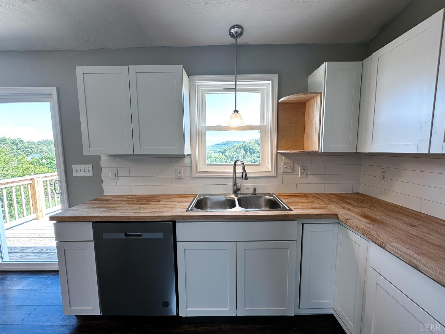 17 Phoebe Pond Road Concord, VA 24538 - Photo 5 of 19 a kitchen with a sink cabinets and window