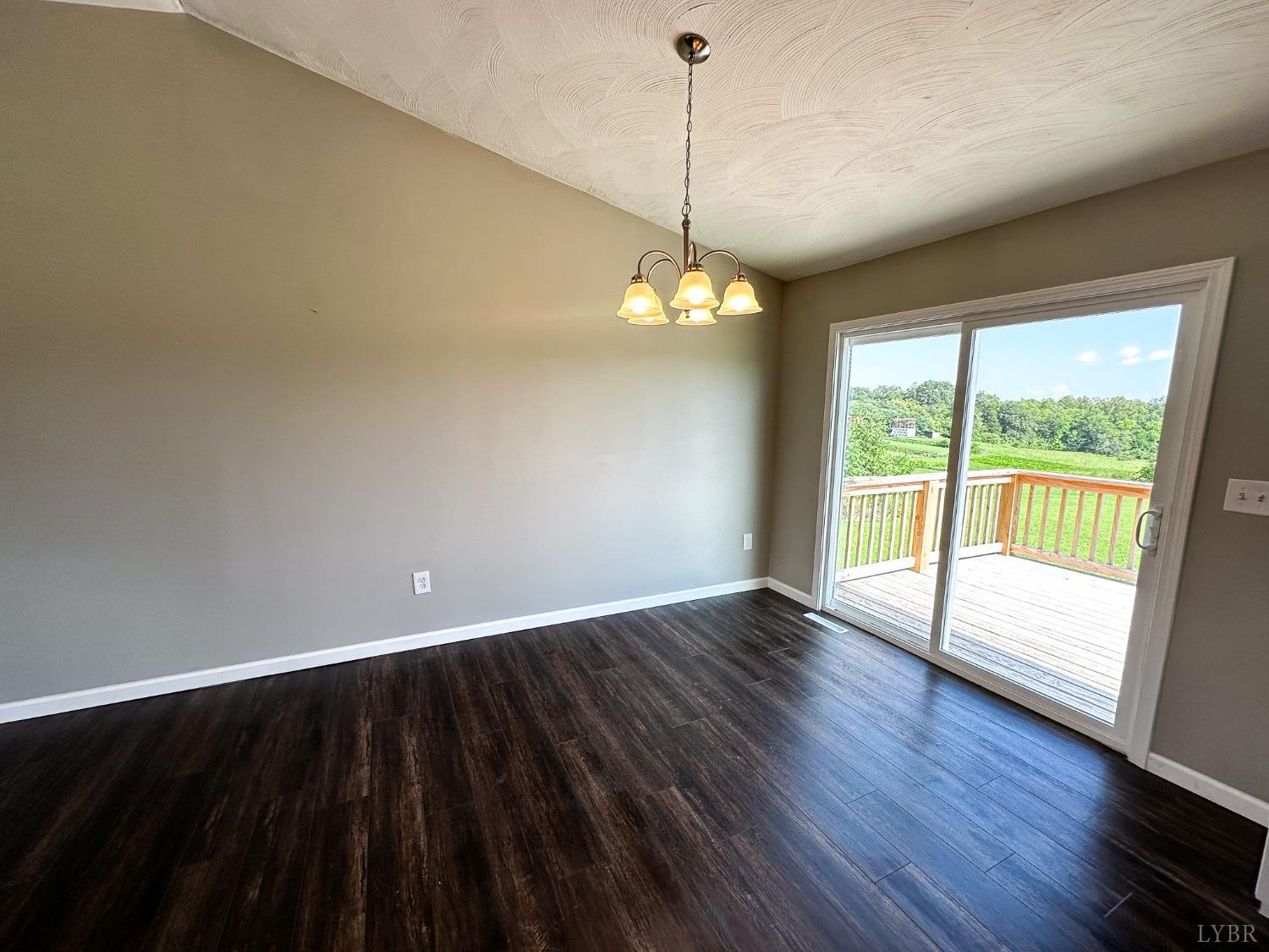 17 Phoebe Pond Road Concord, VA 24538 - Photo 6 of 19 a view of an empty room with wooden floor and a window