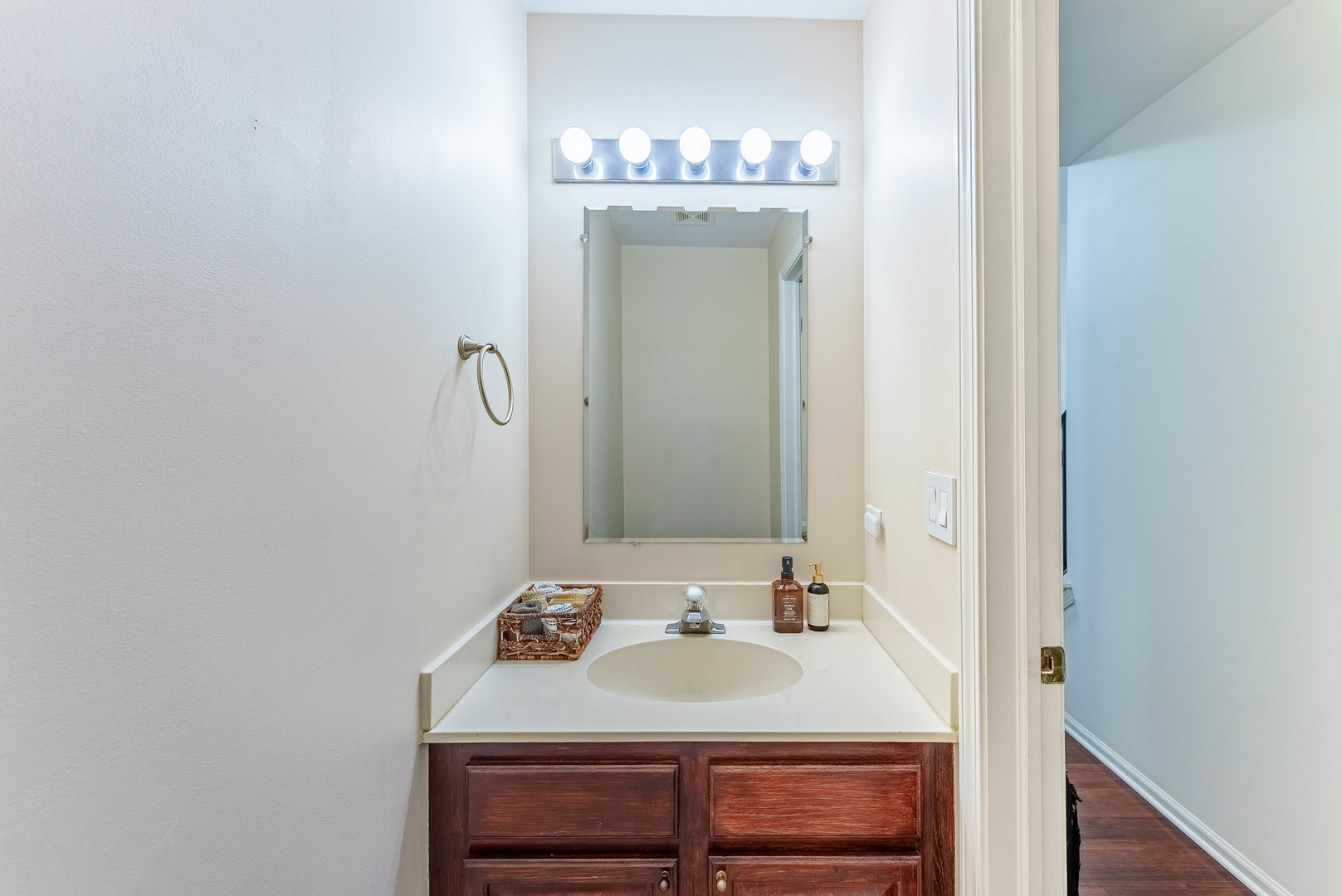 1748 Windward Avenue Naperville, IL 60563 - Photo 16 of 23 a bathroom with a sink and a mirror