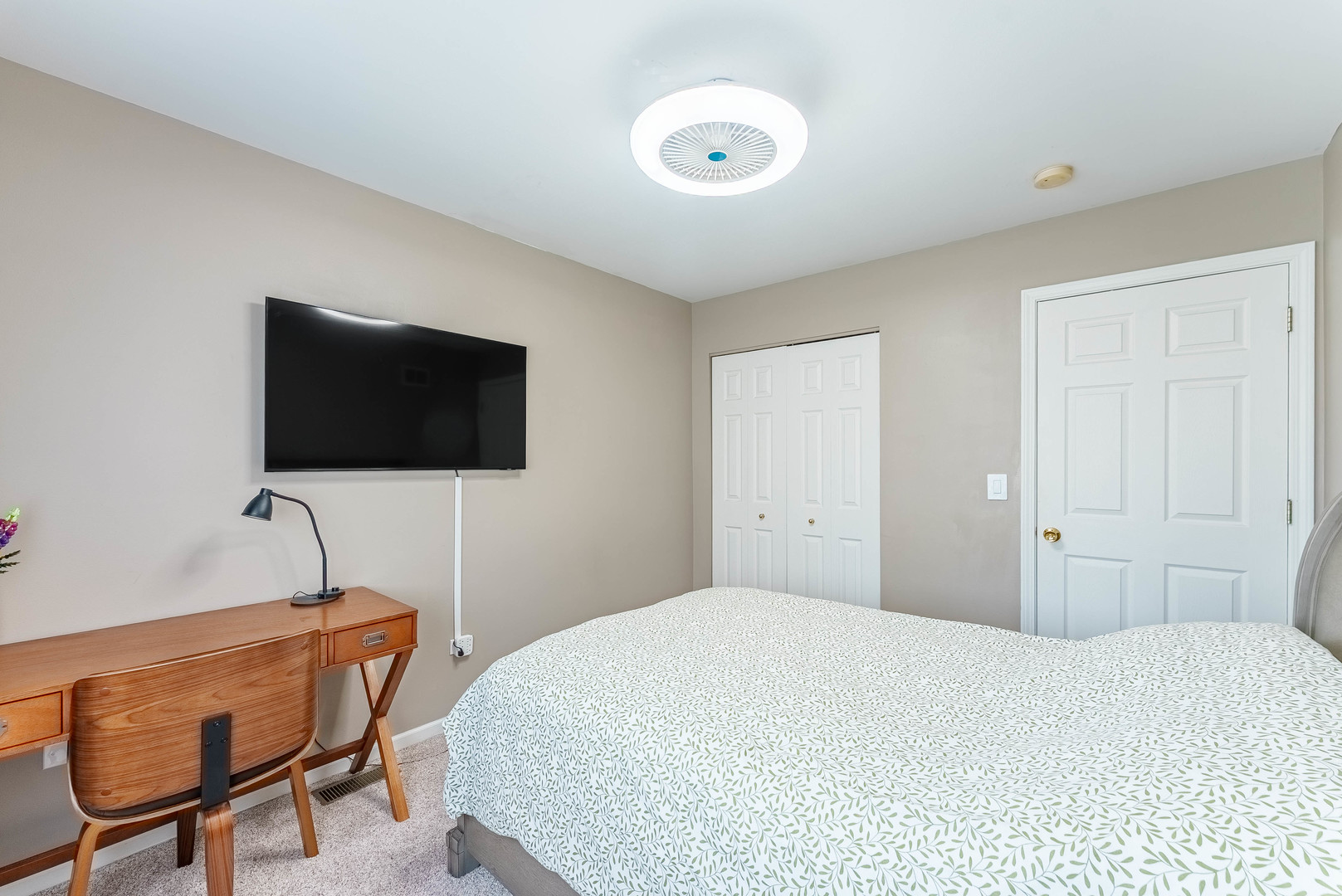 1748 Windward Avenue Naperville, IL 60563 - Photo 17 of 23 a bedroom with a bed and a flat screen tv