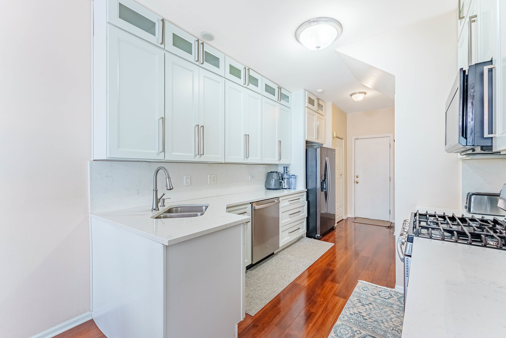 1748 Windward Avenue Naperville, IL 60563 - Photo 2 of 23 a kitchen with stainless steel appliances a refrigerator sink and cabinets