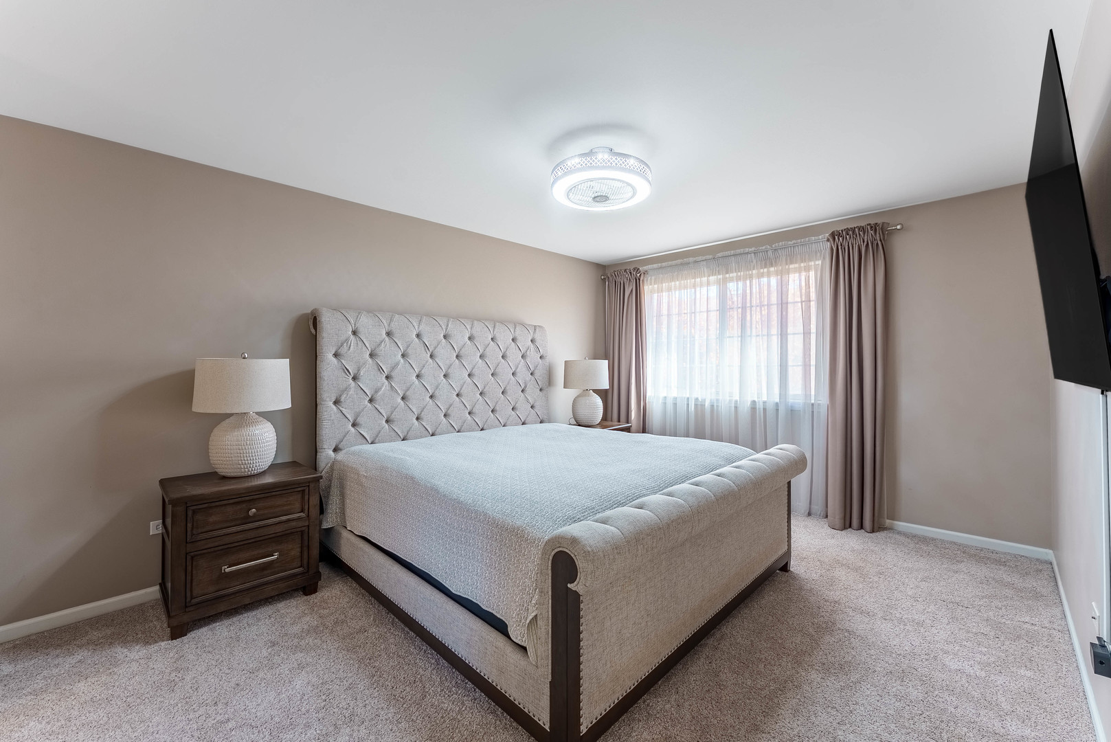 1748 Windward Avenue Naperville, IL 60563 - Photo 5 of 23 a bed sitting in a spacious bedroom next to a window and a flat tv screen