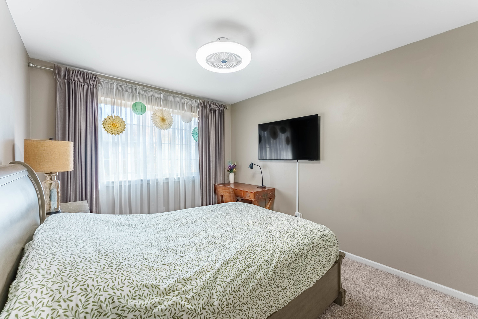 1748 Windward Avenue Naperville, IL 60563 - Photo 7 of 23 a bedroom with a bed and a flat screen tv