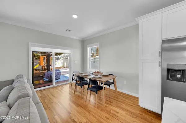 a living room with fireplace furniture and a flat screen tv