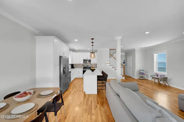 a view of a livingroom with furniture window and wooden floor