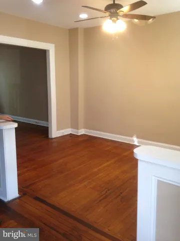 a view of a room with wooden floor