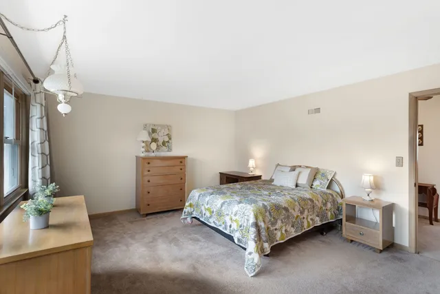 a bedroom with a bed and a couch