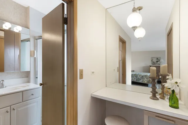 a bathroom with a sink and a mirror