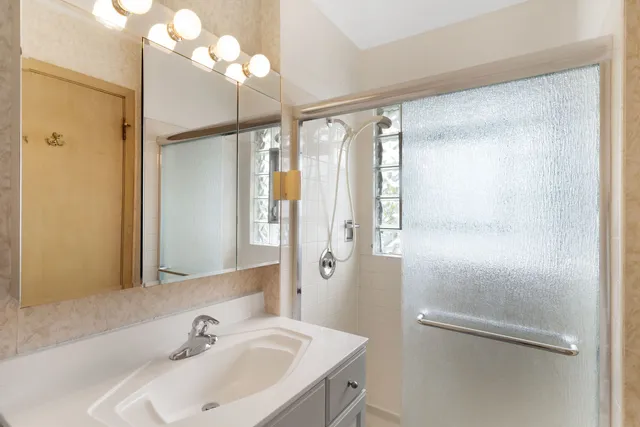 a bathroom with a sink and mirror