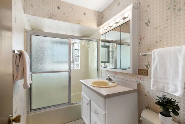 a bathroom with a sink and mirror