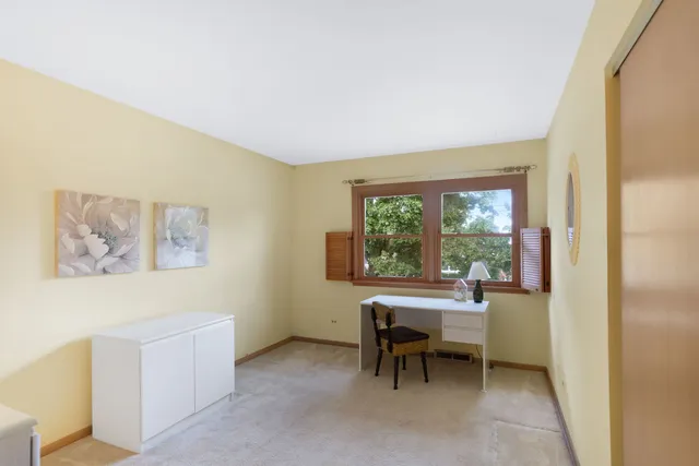 a workspace with furniture and a window