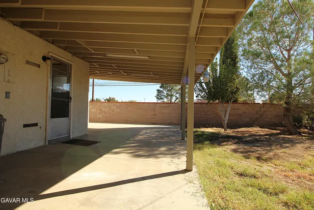 a view of a backyard of the house