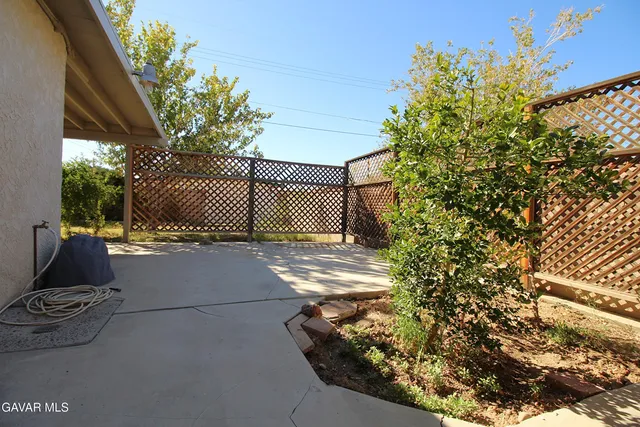 a view of a back yard of the house