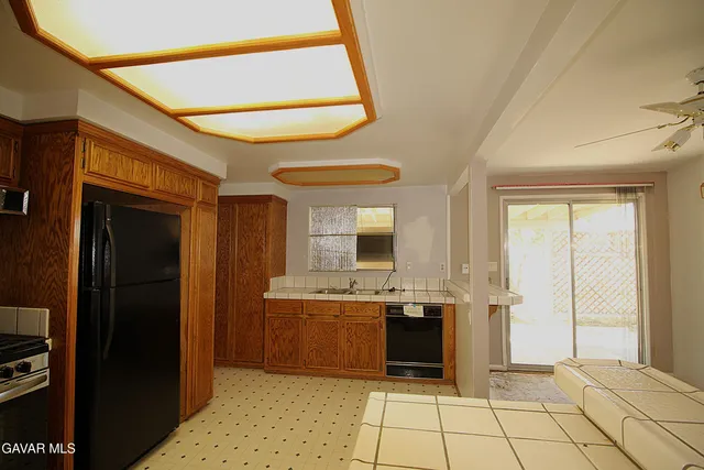a large bathroom with a sink and a mirror