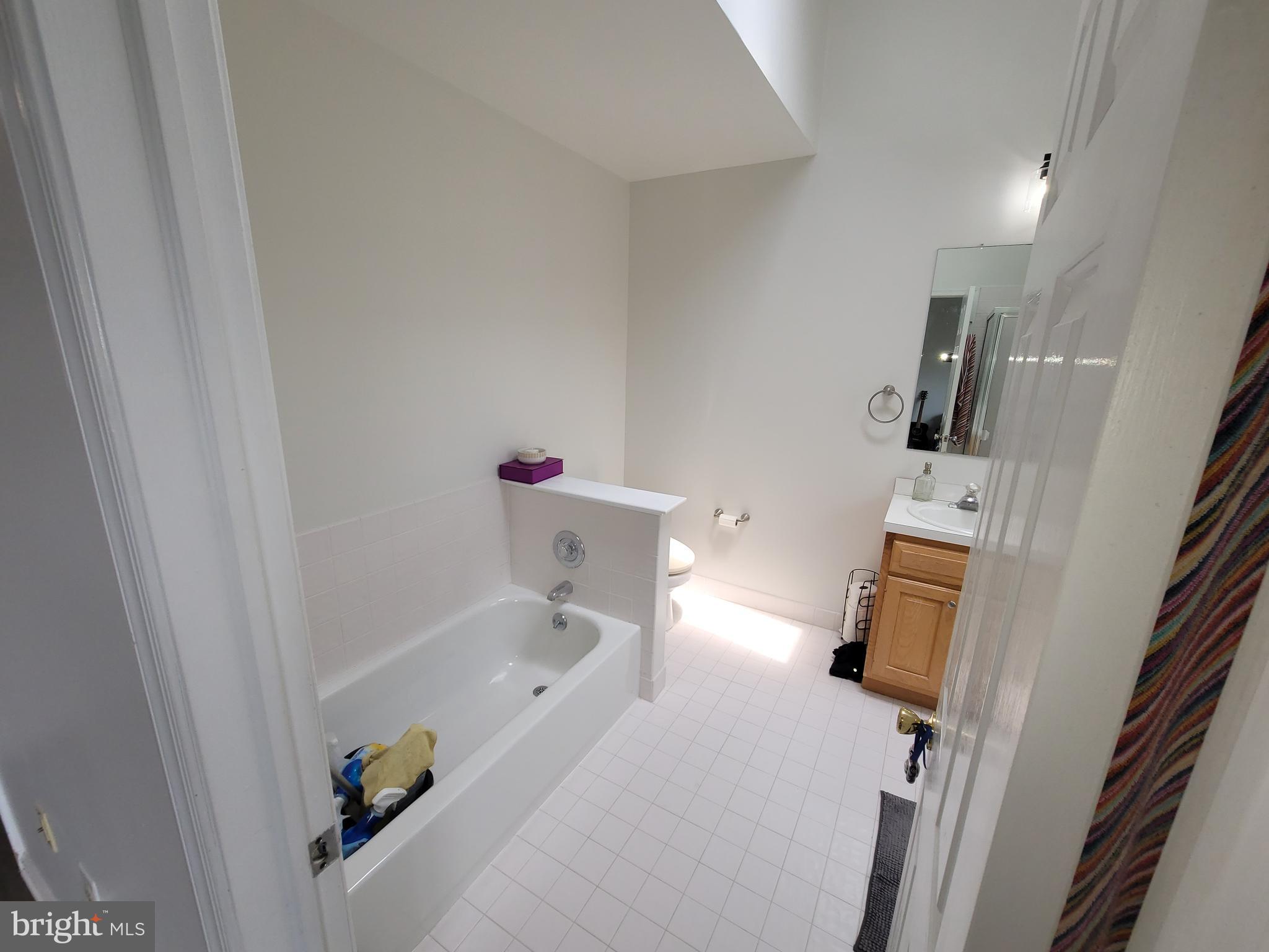 2104 Harrison Court Eagleville, PA 19403 - Photo 13 of 22 a bathroom with a bathtub