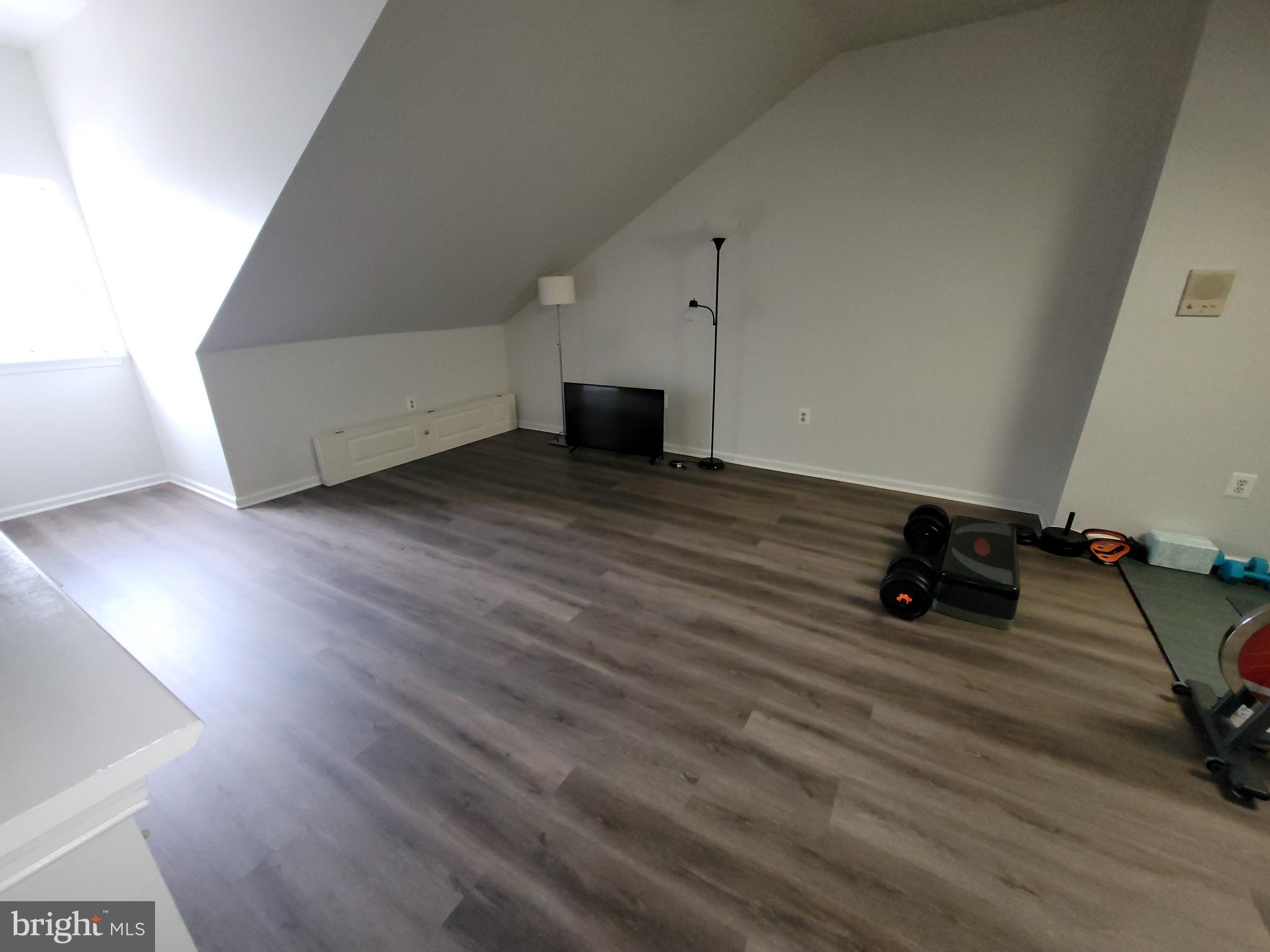 2104 Harrison Court Eagleville, PA 19403 - Photo 18 of 22 a room with hard wood floors and a fireplace