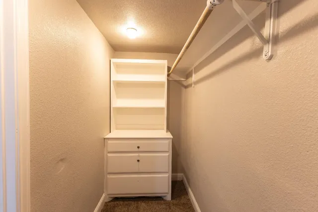 a room with a window and a ceiling fan