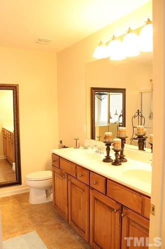 817 Stackhurst Way Wake Forest, NC 27587 - Photo 15 of 23 Upgraded Bathrooms feature Counter-Height vanities. Dual sinks, large soaking tub, and separate walk-in shower.