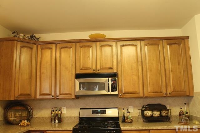 817 Stackhurst Way Wake Forest, NC 27587 - Photo 19 of 23 Look at the beautiful 42 inch Glazed wood cabinets. No lack of storage in this kitchen!