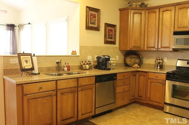 817 Stackhurst Way Wake Forest, NC 27587 - Photo 3 of 23 Upgrades GALORE! 42 inch Glazed Cabinets, Silestone Countertops, and Stainless Steel Appliances!