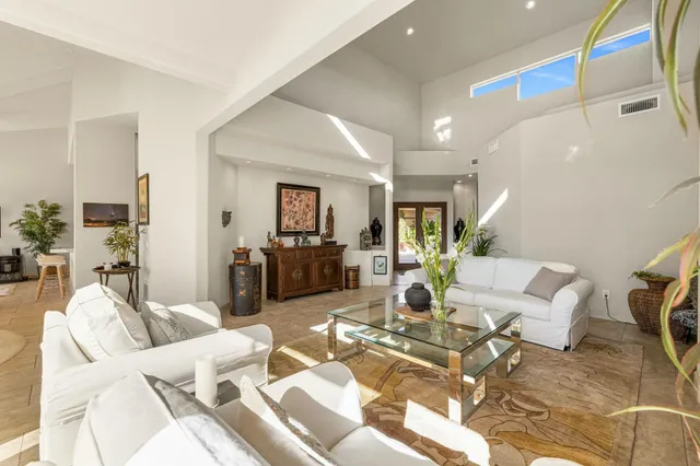 a living room with furniture and a table