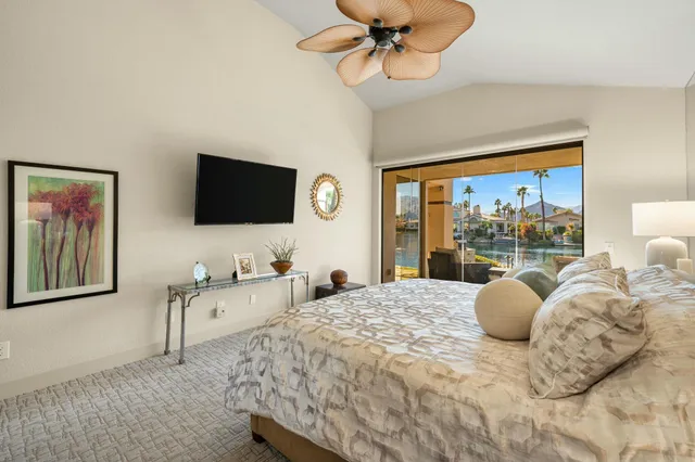 a view of a lake with tables and chairs
