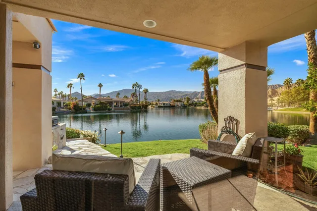 a spacious en suite bathroom with a double vanity sink and a mirror