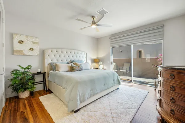 a spacious bathroom with a double vanity sink and mirror