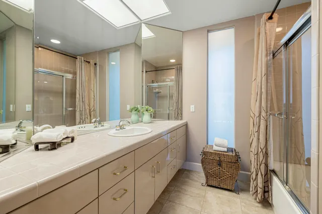 a view of a workspace with furniture and a bookshelf