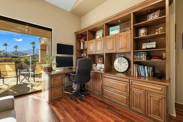 a living room with furniture rug and a window