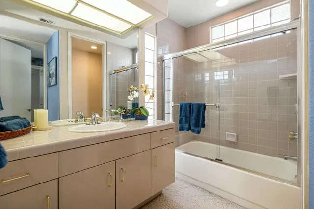 a view of a patio with a table and chairs
