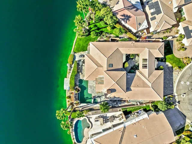 a view of a swimming pool with a yard