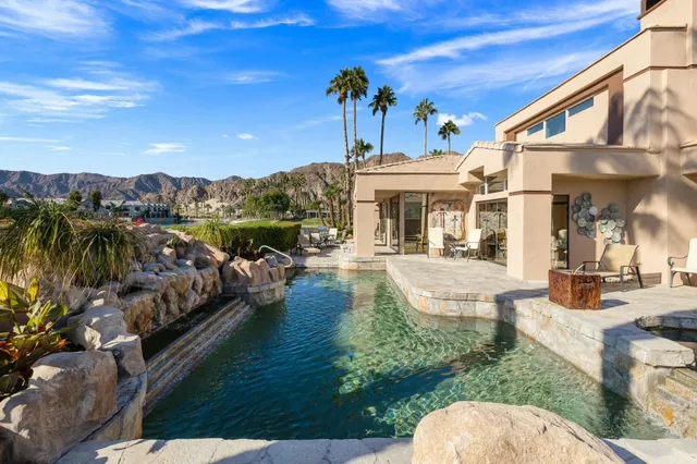 a view of a swimming pool with a patio