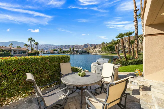 a view of a chairs and table in patio
