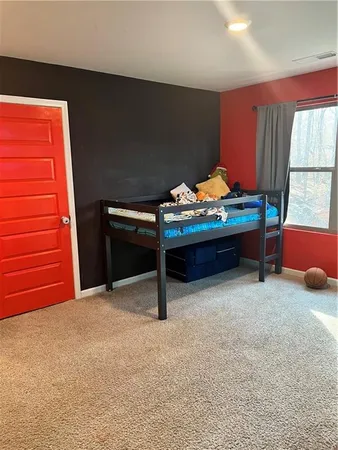 a bedroom with furniture and window