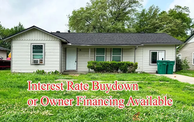 a view of a house with a sign broad front of it