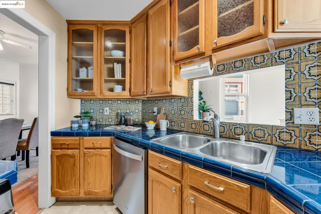 a kitchen with stainless steel appliances granite countertop a sink and cabinets