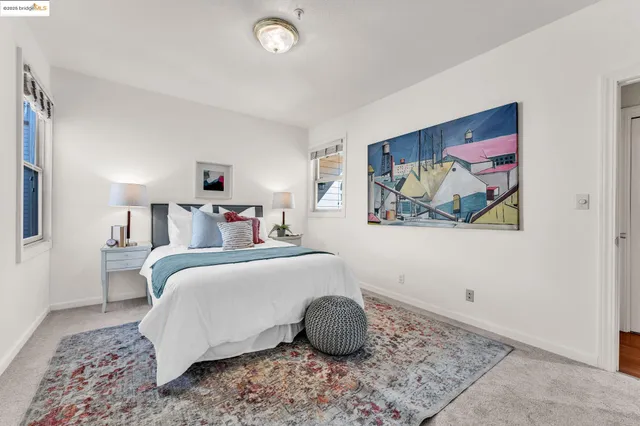 a bedroom with a bed and a couch