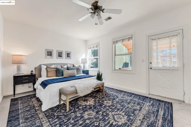 a bed room with a bed and a chandelier