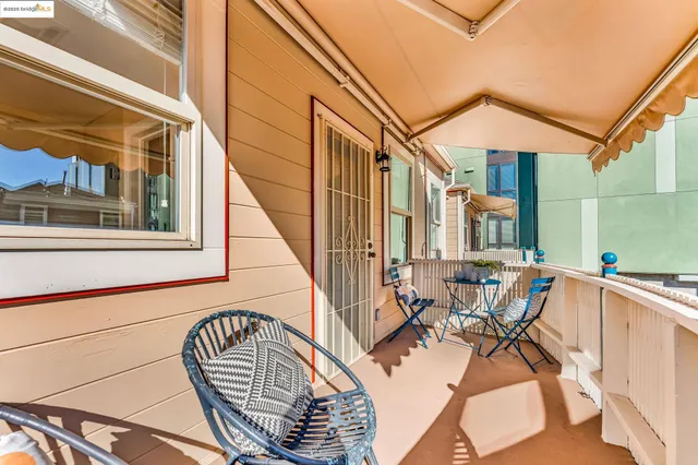 a view of a house with pool and sitting area