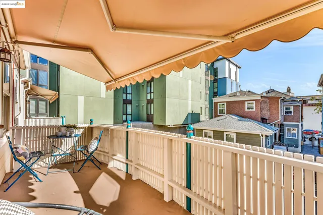 a view of a balcony with chairs