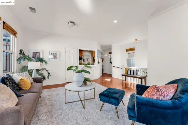 a living room with furniture and a lamp