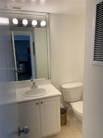 a kitchen with a sink a stove and cabinets