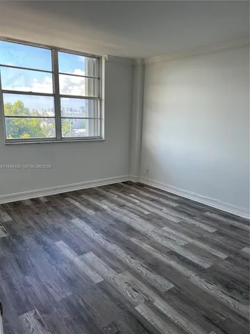 a view of a livingroom with an empty space and a sink