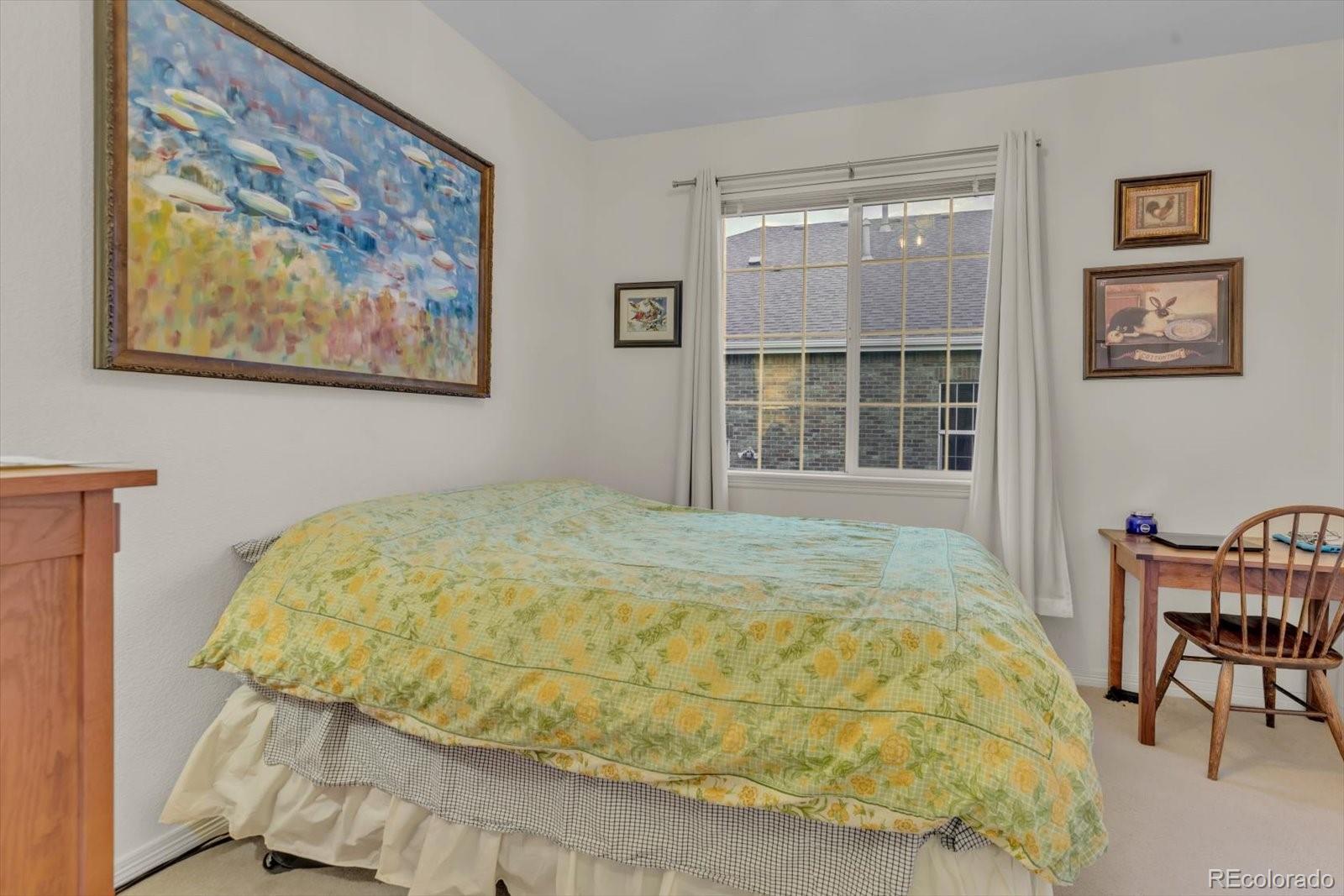 4786 Rabbit Mountain Road Broomfield, CO 80020 - Photo 25 of 41 a bedroom with a bed and a window